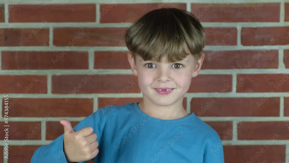 little boy shows thumb up little boy shows thumb up
