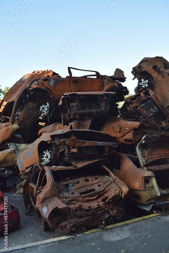 A dump of shot and burned cars of civilians who tried to escape from the Russian invaders during military operations in the Kyiv region (Ukraine).