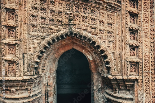 Beautiful details and bas reliefs of ancient Hindu Pancharatna Temple (Temple of the Five Jewels) in Puthia Bangladesh photo
