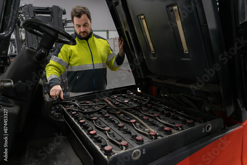 Warehouse manager preparing the forklift battery for its change