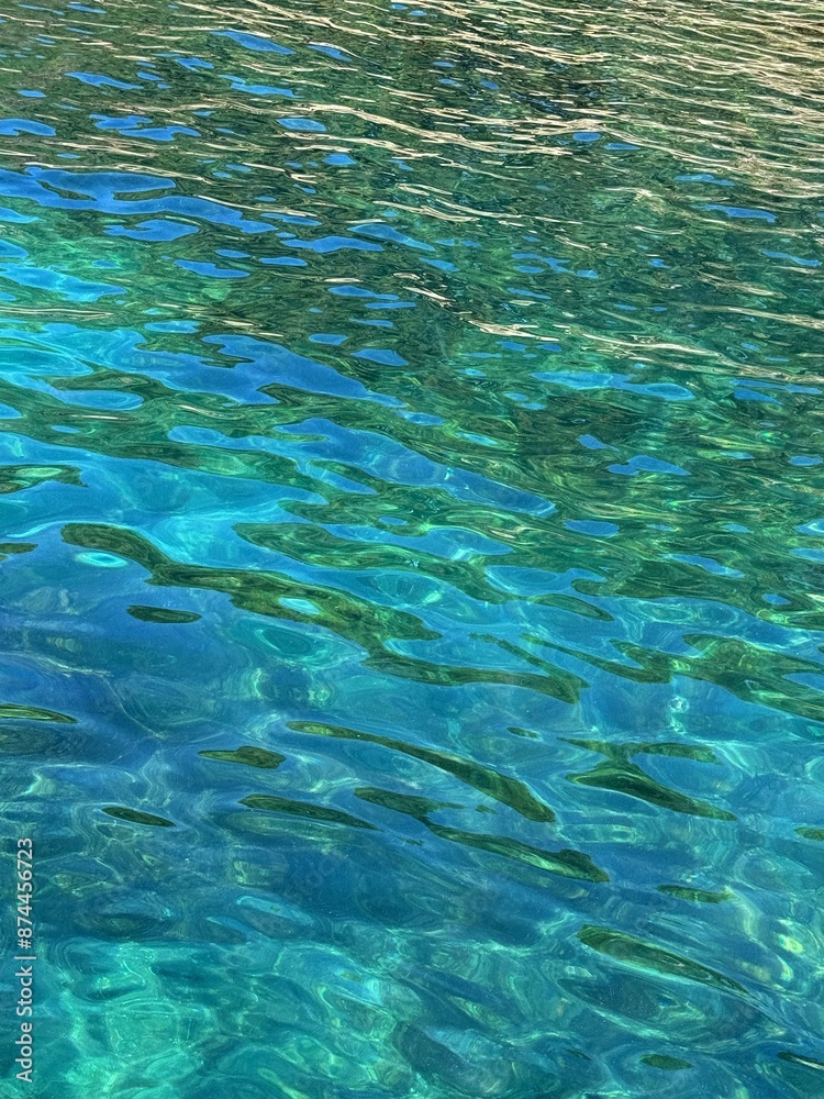 Fototapeta premium Blue turquoise rippled sea water surface 