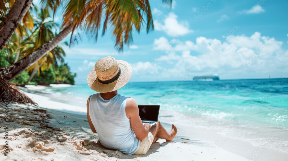 Man works on laptop under palm trees on tropical beach Man works on laptop under palm trees on tropical beach