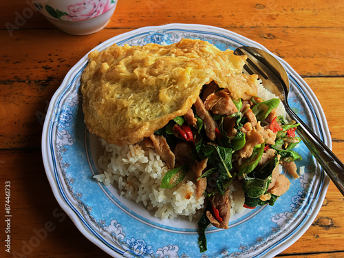 Thai food, stir fried pork with basil and omelet