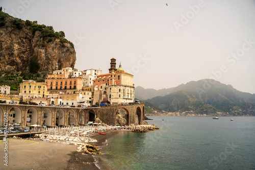 Obraz na płótnie Cloudy view of Amalfi cityscape on coast line of mediterranean sea, Italy w salonie