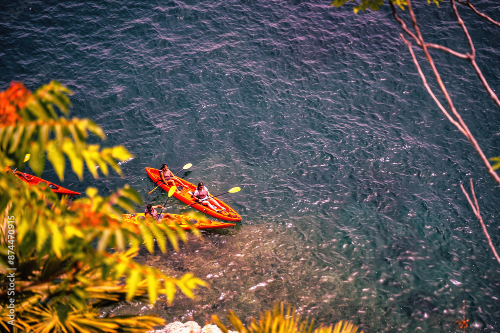 Amalfi, Italy - June 24, 2024: Aerial View of a Kayaker on Clear Waters, Top-down perspective of a kayaker in a kayak or canoe boats navigating the crystalline blue waters of Mediterranean Sea