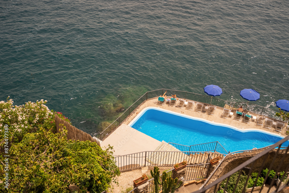 cliffside pool by the ocean in the town of Amalfi in southern italy