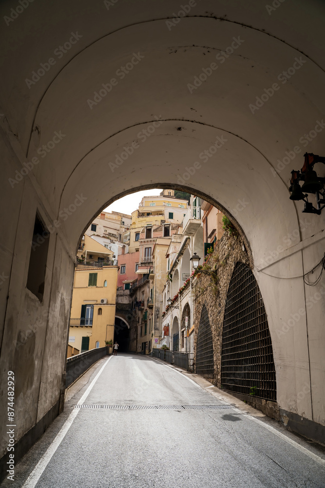City of Amalfi town and typical building facade through a tunnel view on southern italy