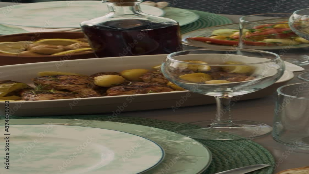 Vertical top pan shot of scrumptious foods on table, ready for Sunday lunch or brunch in family home - toasted bread with butter, roast chicken with vegetables, pickled mushrooms, pie, homemade wine Vertical top pan shot of scrumptious foods on table, ready for Sunday lunch or brunch in family home - toasted bread with butter, roast chicken with vegetables, pickled mushrooms, pie, homemade wine