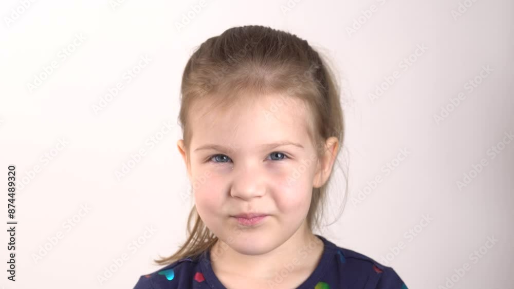 Smiling girl. Close-up portrait of attractive cute cheerful toddler girl enjoying good mood. A five-year-old girl with blond hair smiles sweetly and looks at the camera. Smiling girl. Close-up portrait of attractive cute cheerful toddler girl enjoying good mood. A five-year-old girl with blond hair smiles sweetly and looks at the camera.