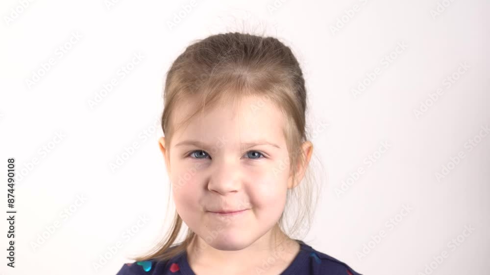 Portrait of a cute toddler girl eating red berries and smiling. Portrait of a cute toddler girl eating red berries and smiling.