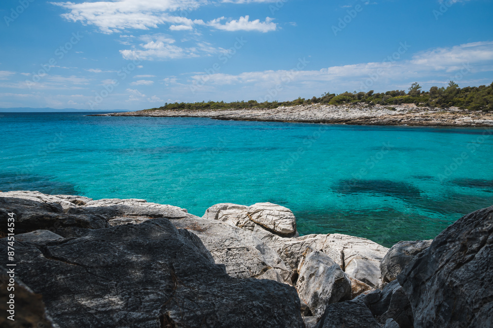 Beautiful turquoise blue sea along the rocky coast of Atspas beach on the island of Thasos in Greece Beautiful turquoise blue sea along the rocky coast of Atspas beach on the island of Thasos in Greece