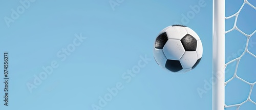 A soccer ball mid air heading towards the goal, capturing the excitement of the game with copy space photo