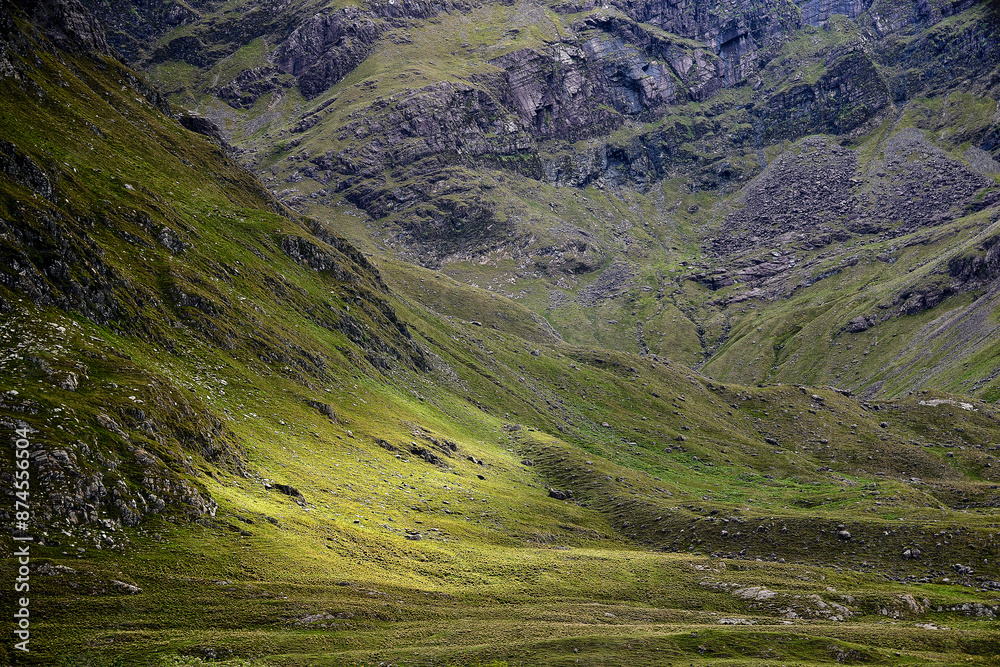 evening landscape mountains light green grass