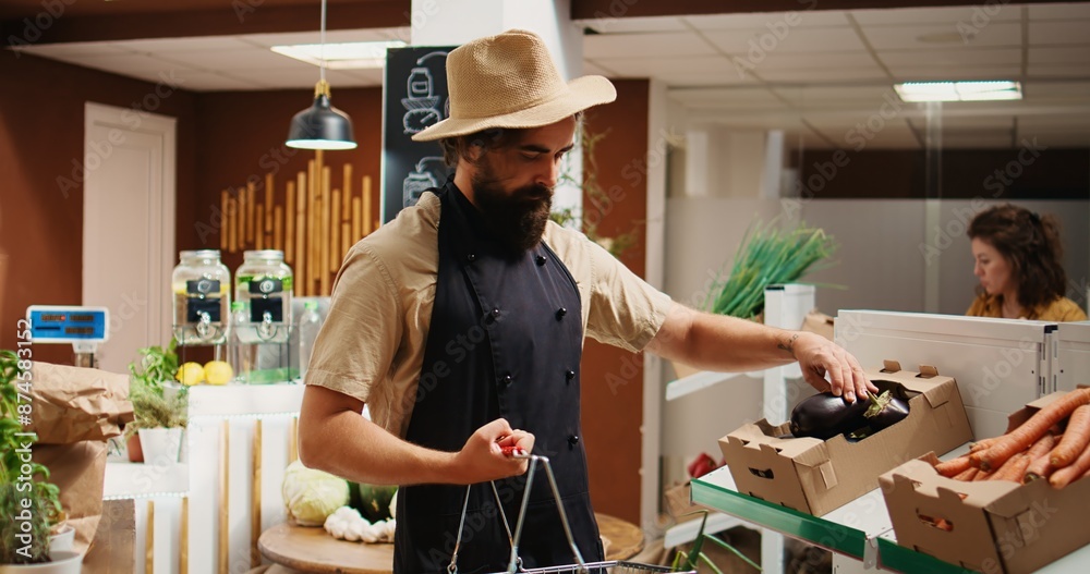 Storekeeper arriving in green living bio supermarket with freshly harvested farm grown food. Vendor restocks local neighborhood grocery shop with pesticides free ethically sourced vegetables Storekeeper arriving in green living bio supermarket with freshly harvested farm grown food. Vendor restocks local neighborhood grocery shop with pesticides free ethically sourced vegetables