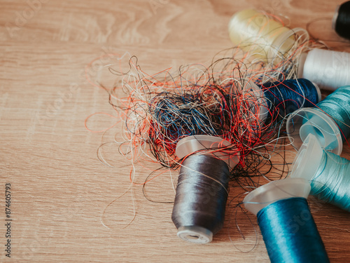 Spools of colored embroidery threads. Huge knot is haphazardly braided. Extreme macro. Beautiful story for intro. Title credits. Abstract screensaver. Handicraft entropy concept. Disorder measure photo