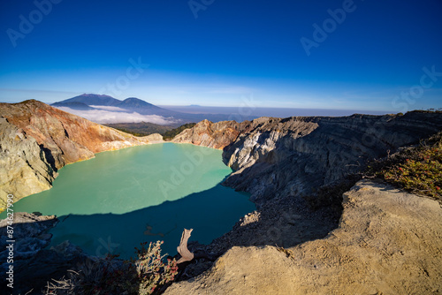 Aerial view Kawah Ijen volcano with turquoise sulfur water lake at sunrise.Amazing nature landscape view at East Java, Indonesia. Natural landscape background