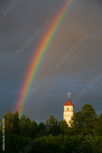 Rainbow and old church photo