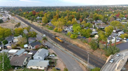 Train entering the Roseville, California yard Under the Sierra Vista Bridge aerial view.,