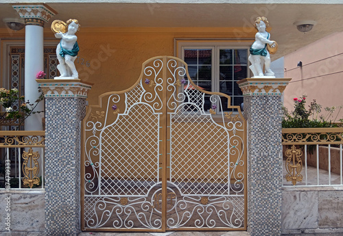 Wrought gate with fence in old park.