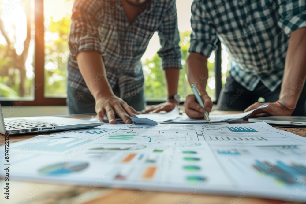 Obraz premium Two Businessmen Collaborating on a Project