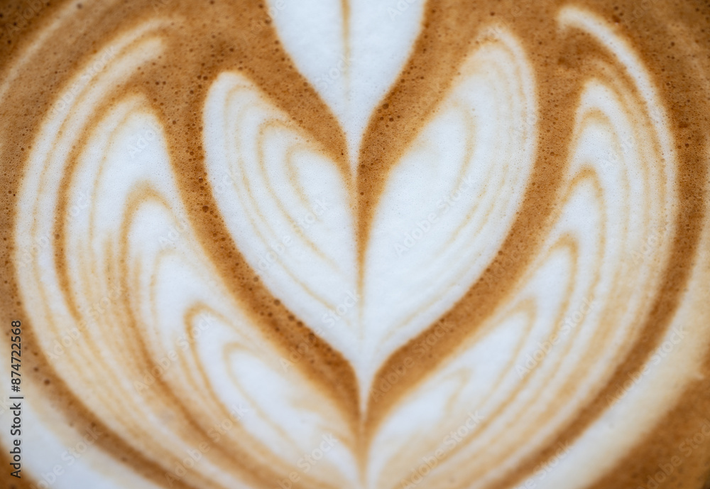 Close up of the surface of hot latte coffee. A latte is a coffee drink made with espresso and steamed milk.