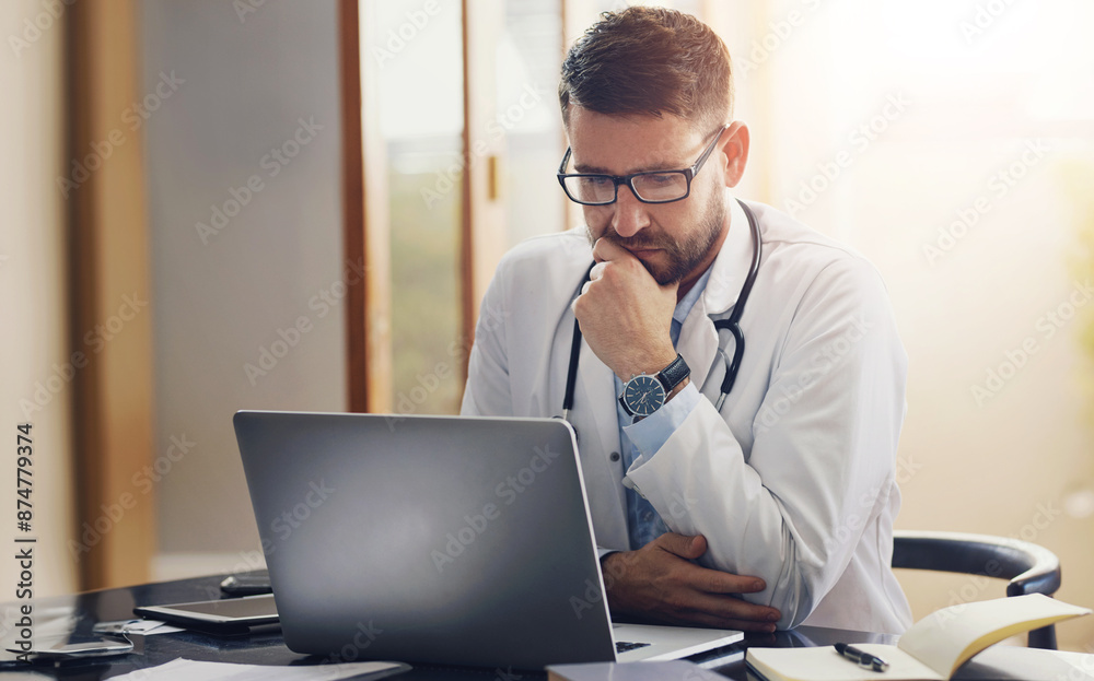 Male person, doctor and laptop with thinking, ideas and planning in office as medical professional. Man, pediatrician and diagnosis, telehealth and technology for patient records, medicine or surgery