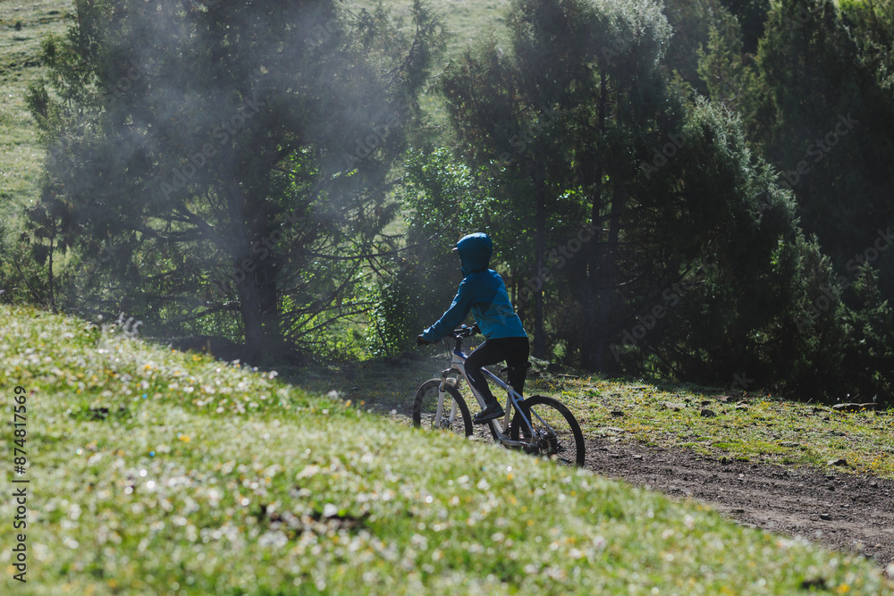 Naklejka premium Riding mountain bike in the beautiful mountains
