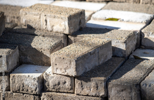 Paving stones lie on the ground.