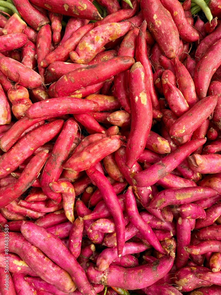 Natural pattern of organic sweet potatoes. Red potatoes vegetable background. Healthy plant food Natural pattern of organic sweet potatoes. Red potatoes vegetable background. Healthy plant food