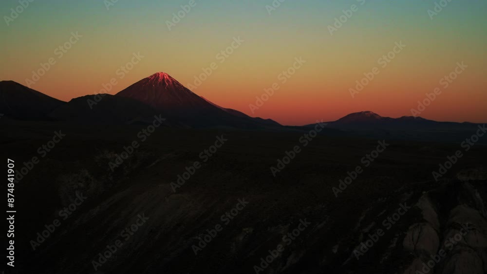 Aerial Panning Scenic Shot Of Snowcapped Volcanic Mountains, Drone Flying In Tranquil Desert During Sunset - Atacama Desert, Chile Aerial Panning Scenic Shot Of Snowcapped Volcanic Mountains, Drone Flying In Tranquil Desert During Sunset - Atacama Desert, Chile