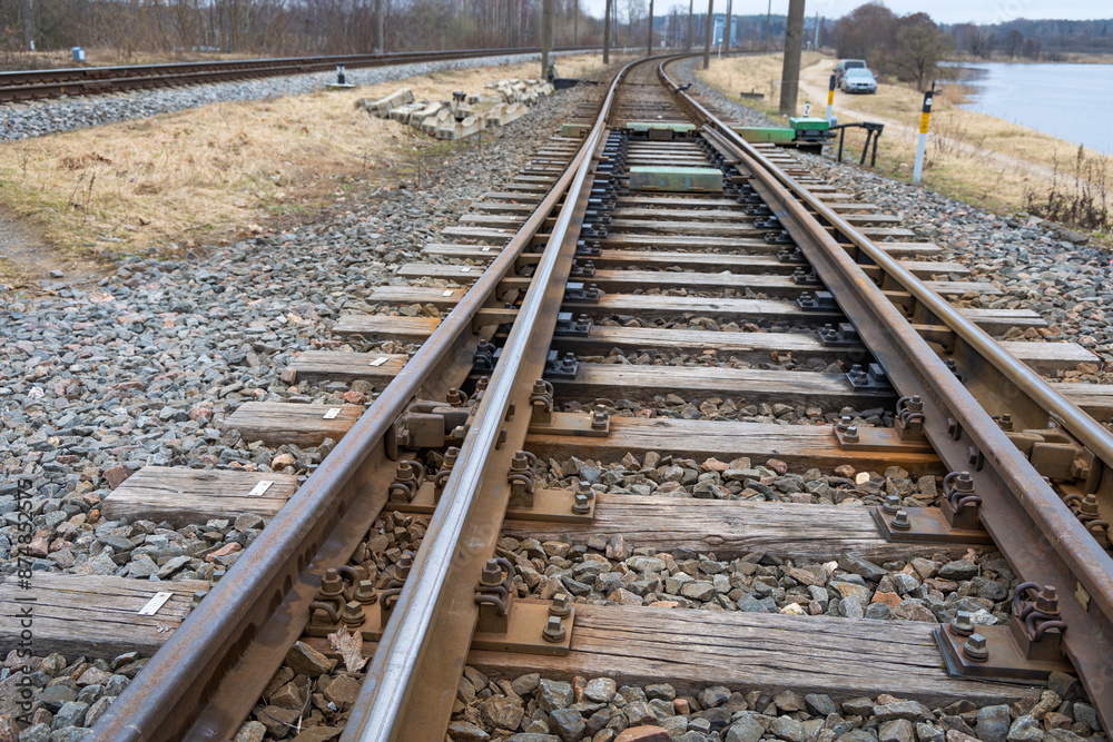 Fototapeta premium Beautiful railroad tracks in Riga, Latvia. Overcast spring day.
