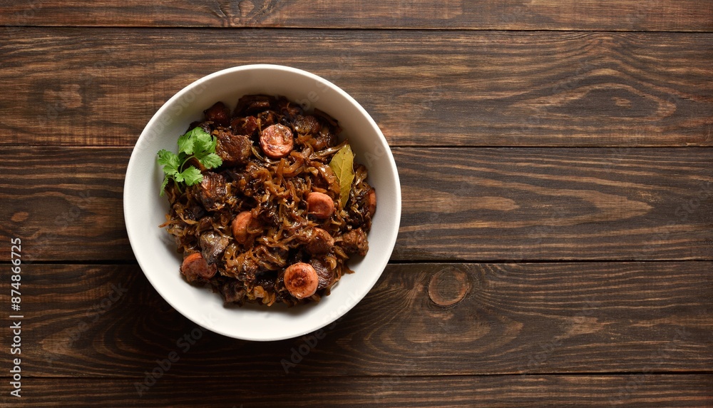 Stewed cabbage with sauerkraut, mushrooms, smoked meats and spices Stewed cabbage with sauerkraut, mushrooms, smoked meats and spices