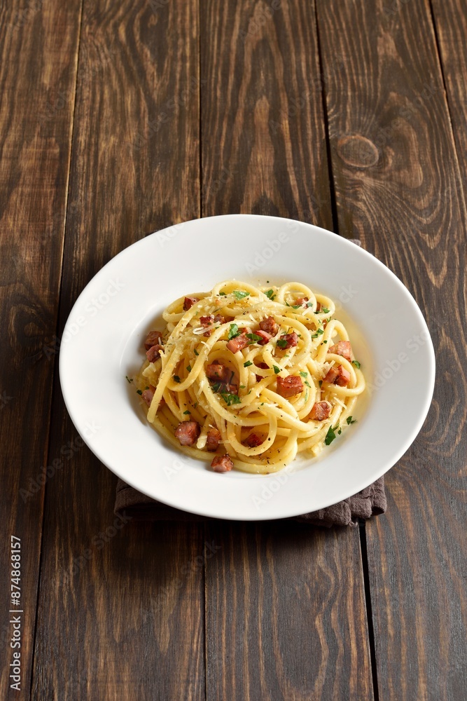 Carbonara pasta, spaghetti with crisp pancetta and black pepper Carbonara pasta, spaghetti with crisp pancetta and black pepper