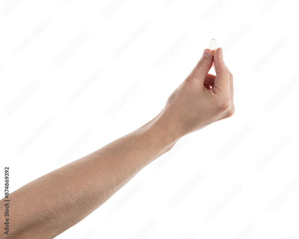 Male hand hold transparent pill isolated on white Male hand hold transparent pill isolated on white