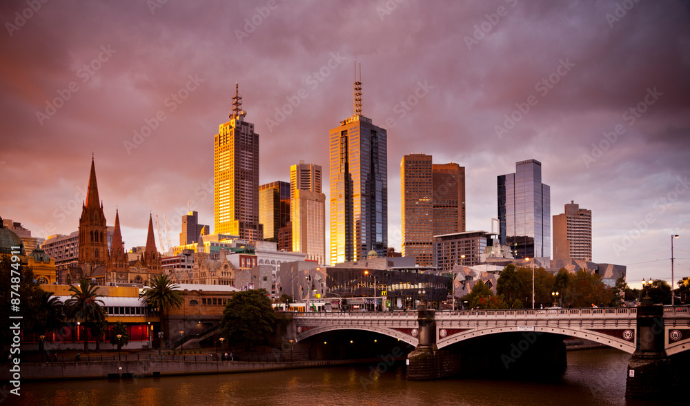 Fototapeta premium The city centre of Melbourne, Victoria, Australia. Towers gleam in the evening light. Golden hour.