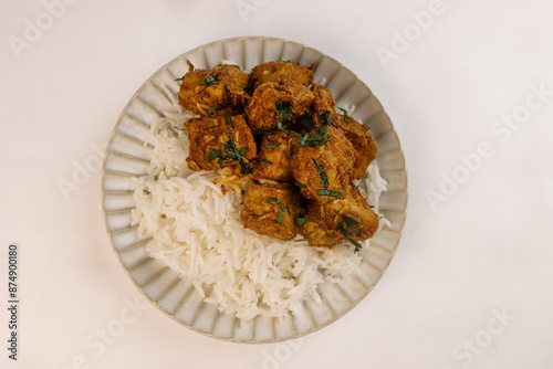 Chicken Bhuna Curry is a Spicy and Flavorful Dish from Indian Cuisine, Served with Rice.  photo