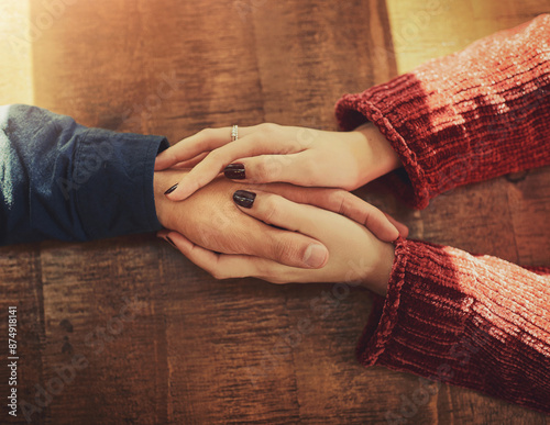 Restaurant, table and couple holding hands with love on anniversary, date and empathy with care. Man, woman and trust with support, partnership and loyalty to commitment or travel for bonding