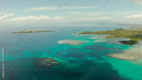 Seascape: Tropical Islands with beaches and azure coral reef water from above. Bucas grande, Philippines. Summer and travel vacation concept. photo