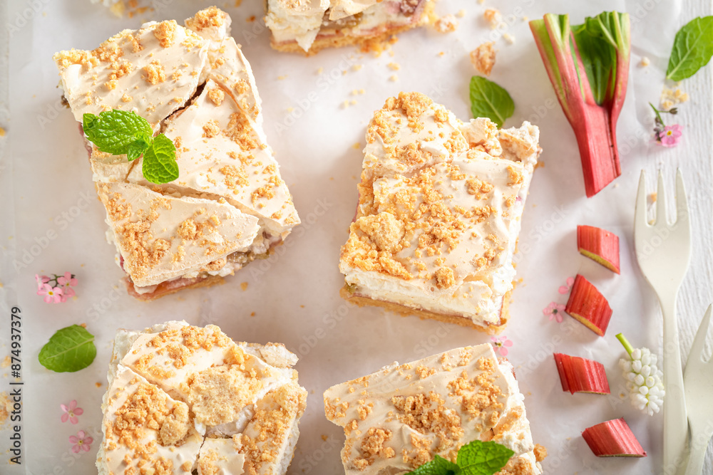 Tasty and sweet rhubarb yeast cake served with tea. Tasty and sweet rhubarb yeast cake served with tea.