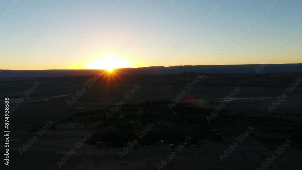 Aerial Shot Of Structures Amidst Trees In Semi Arid Desert Against Clear Sky, Drone Flying Backwards During Sunset - Atacama Desert, Chile Aerial Shot Of Structures Amidst Trees In Semi Arid Desert Against Clear Sky, Drone Flying Backwards During Sunset - Atacama Desert, Chile