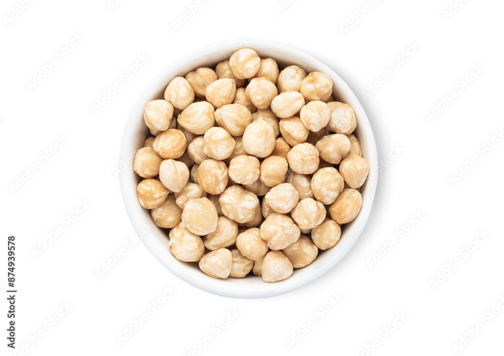 Bowl with healthy white shelless hazelnut nuts isolated on white background.Top view. Bowl with healthy white shelless hazelnut nuts isolated on white background.Top view.