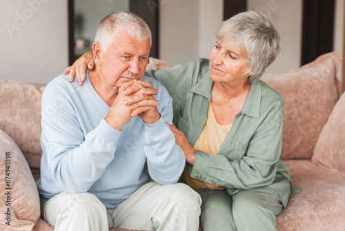 Bild auf Leinwand Sad wife feels sorry for her suffering senior husband, provides support and love