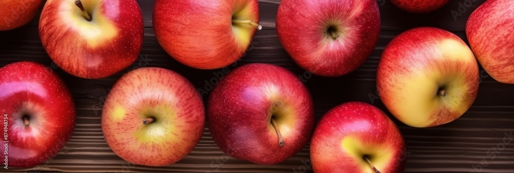 Scrumptious red apples arranged beautifully on a wooden table Scrumptious red apples arranged beautifully on a wooden table