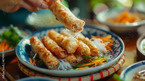 Asian fried spring rolls filled with tofu, cabbage, carrots and glass noodles eaten with dipping sauce. Vegan food