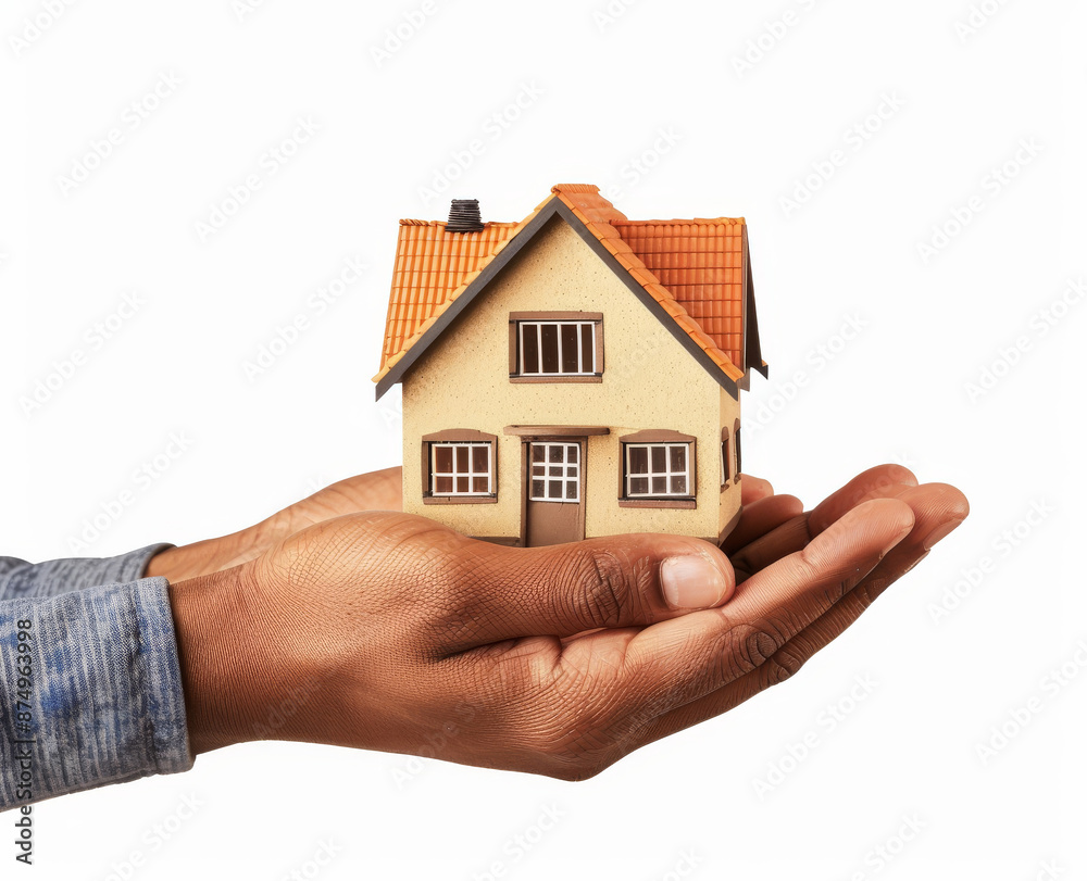Hands holding a small house isolated on a white background. Hands holding a small house isolated on a white background.