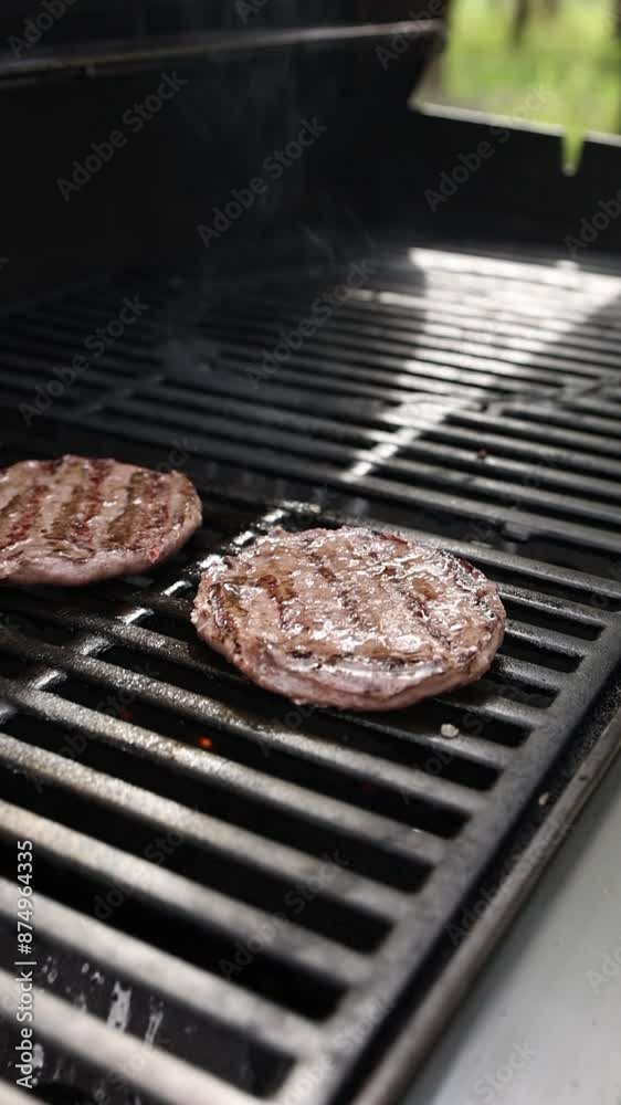 People grilling delicious hamburger patties People grilling delicious hamburger patties