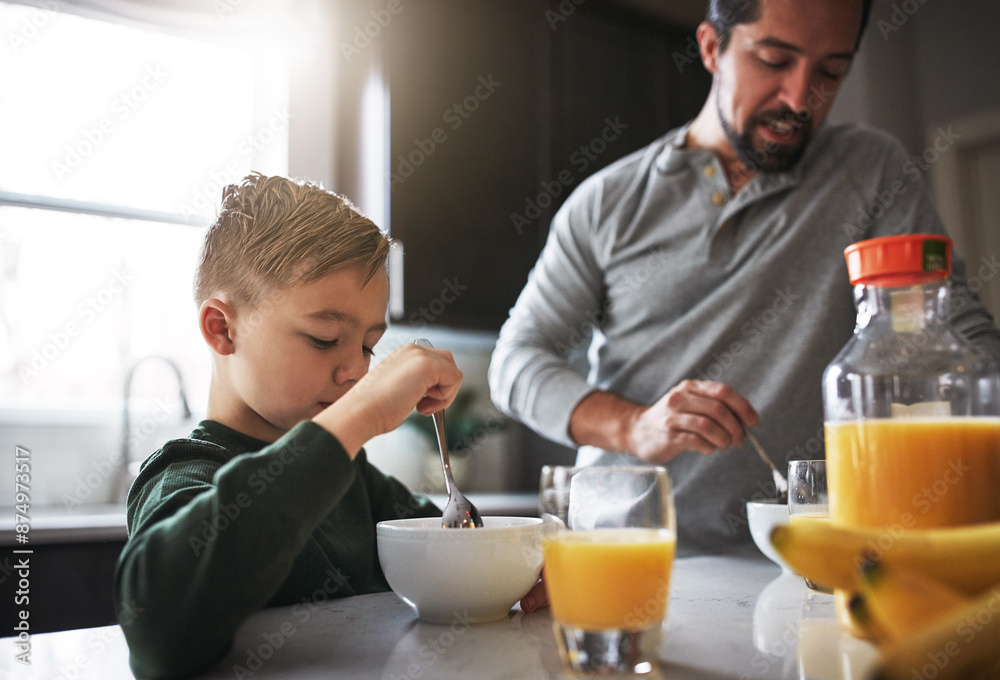 Talking, breakfast and father with child in kitchen for nutrition, health and development. Happy, kid and bowl for cereal with orange juice for vitamins, conversation and wellness on weekend in home Talking, breakfast and father with child in kitchen for nutrition, health and development. Happy, kid and bowl for cereal with orange juice for vitamins, conversation and wellness on weekend in home
