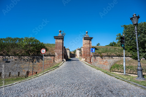 Entrance to the Petrovaradin fortress. An arch in the Petrovaradin fortress in Novi Sad, Serbia. Grandeur of Petrovaradin Palace in Novi Sad, a historic fortress adorned with vibrant gardens.