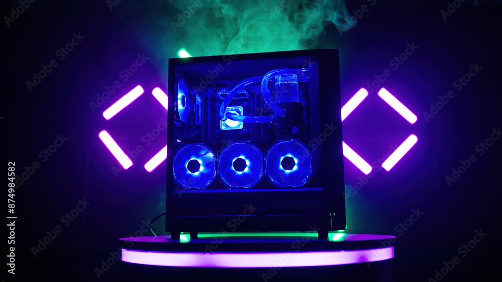 Naklejka premium RGB gaming computer case side view blue fans and smoke background