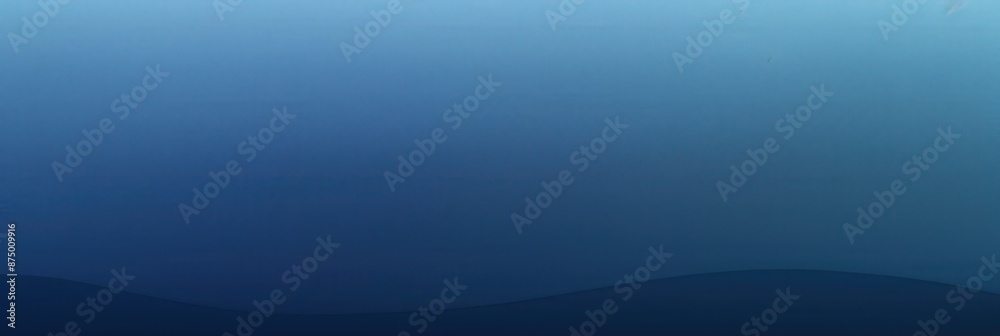 Obraz premium Simple blue gradient background with a subtle curve at the bottom